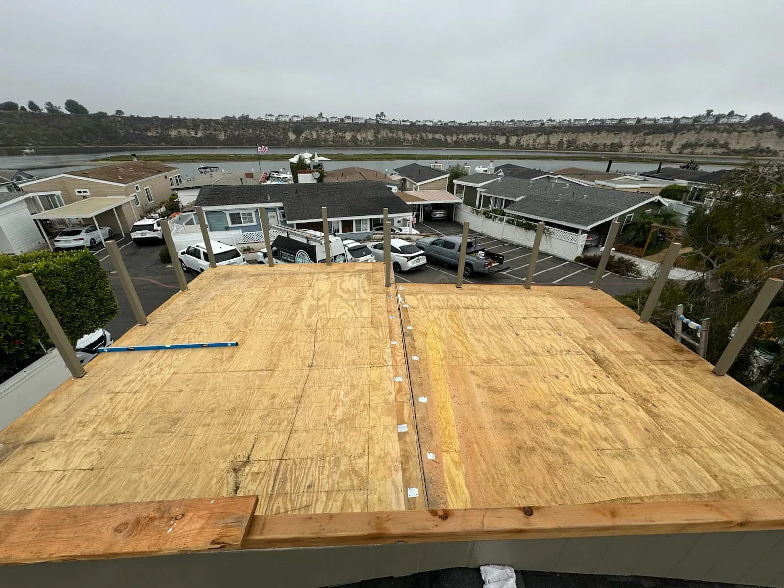 Clean plywood deck surface prepared for washing before sealing