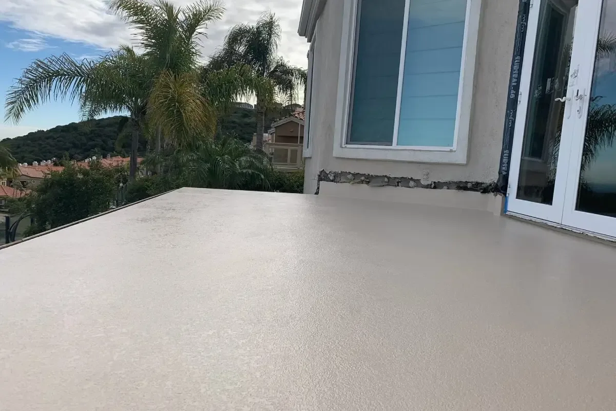 Freshly applied deck sealing paint protecting an outdoor deck surface